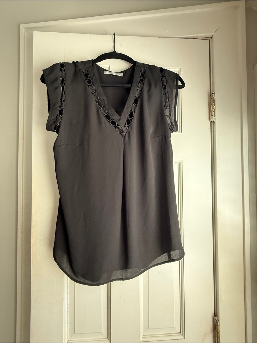 Sleeveless V-Neck Black Blouse with Eyelet Trim